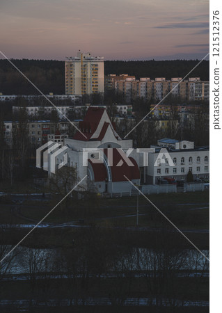 View of the church from above. A view of the city of Minsk from above at sunset View of the church from above. A view of the city of Minsk from above at sunset 121512376