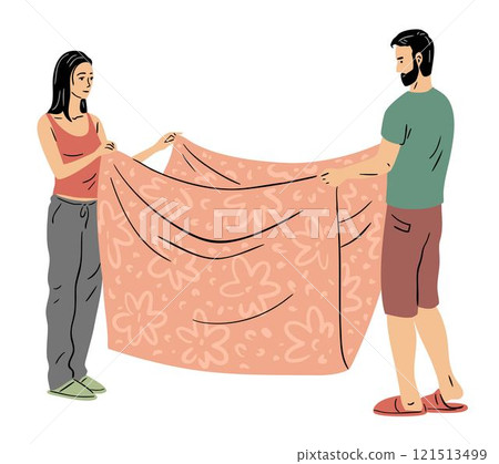 A young couple is laying out their linen and blanket A young couple is laying out their linen and blanket 121513499