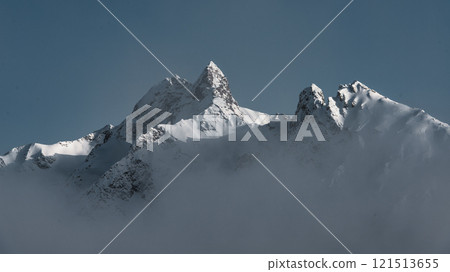 Panoramic landscape of snow mountains. and clouds Panoramic landscape of snow mountains. and clouds 121513655
