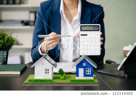 Considering buying a home, investing in real estate. Broker signs a sales agreement. agent, lease agreement, successful Considering buying a home, investing in real estate. Broker signs a sales agreement. agent, lease agreement, successful 121514305