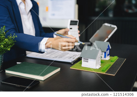 Considering buying a home, investing in real estate. Broker signs a sales agreement. agent, lease agreement, successful Considering buying a home, investing in real estate. Broker signs a sales agreement. agent, lease agreement, successful 121514306