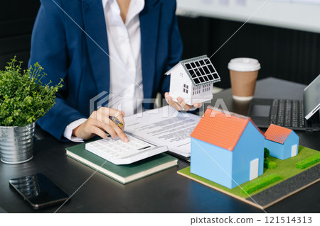 Considering buying a home, investing in real estate. Broker signs a sales agreement. agent, lease agreement, successful Considering buying a home, investing in real estate. Broker signs a sales agreement. agent, lease agreement, successful 121514313