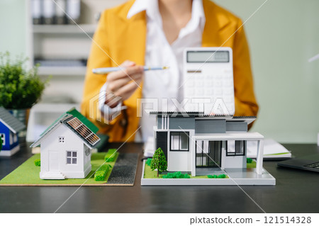 Signing a contract. Client and broker agent, lease agreement, successful deal and Young business sitting at the desk Signing a contract. Client and broker agent, lease agreement, successful deal and Young business sitting at the desk 121514328