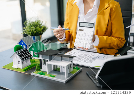 Signing a contract. Client and broker agent, lease agreement, successful deal and Young business sitting at the desk Signing a contract. Client and broker agent, lease agreement, successful deal and Young business sitting at the desk 121514329
