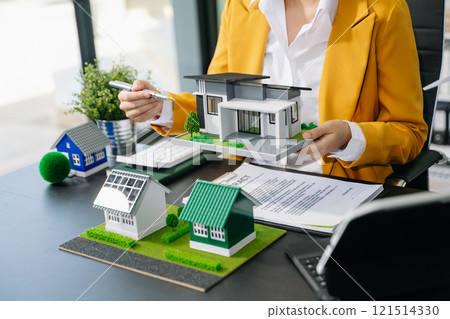 Signing a contract. Client and broker agent, lease agreement, successful deal and Young business sitting at the desk Signing a contract. Client and broker agent, lease agreement, successful deal and Young business sitting at the desk 121514330