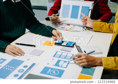 Close up view of UI developer team brainstorming on their project with laptop, smartphone and digital tablet. 121514468