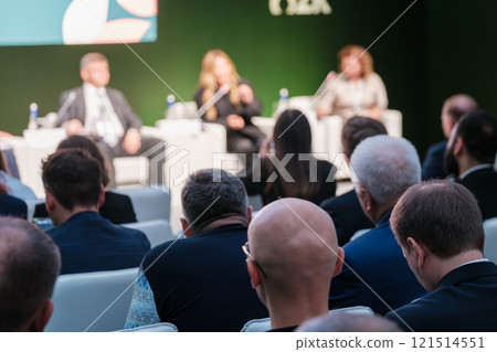 Audience listens attentively during a professional business conference in an event setting 121514551