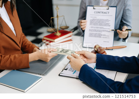 Lawyer refusing bribe money in the envelop from business man at lawyer office. Lawyer refusing bribe money in the envelop from business man at lawyer office. 121514753