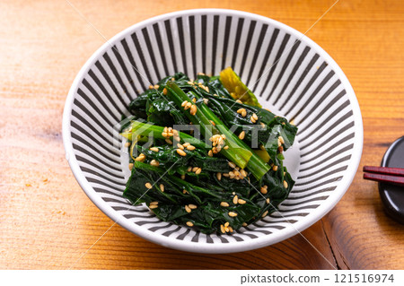 Curly spinach with sesame seeds Curly spinach with sesame seeds 121516974