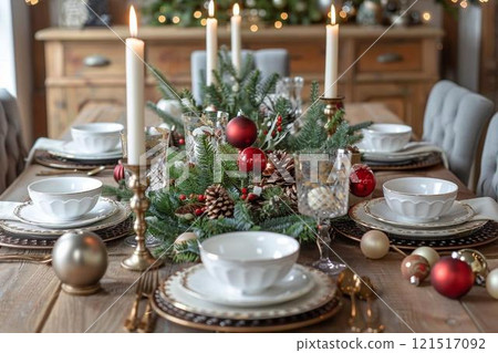 Elegant Christmas Table Setting with Candles and Greenery 121517092