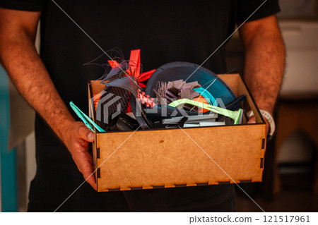 Cardboard carton boxes stack with household belongings in modern house living room. Packed containers on floor in new home. Cardboard carton boxes stack with household belongings in modern house living room. Packed containers on floor in new home. 121517961