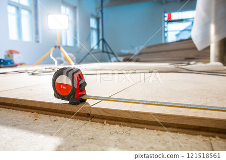 Indoor Construction Scene with Measuring Tape and Work Light 121518561