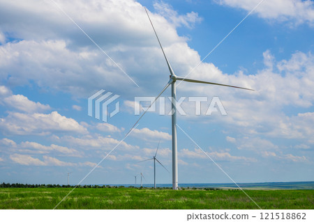 A wind farm or wind farm with high wind turbines to generate electricity.Modern new environment saving innovation technologies.Copy space A wind farm or wind farm with high wind turbines to generate electricity.Modern new environment saving innovation technologies.Copy space 121518862