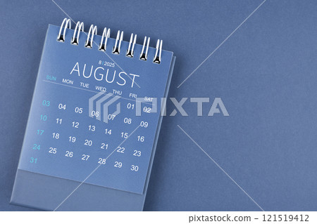 August 2025 calendar on blue color background. Desk calendar for planning. 121519412
