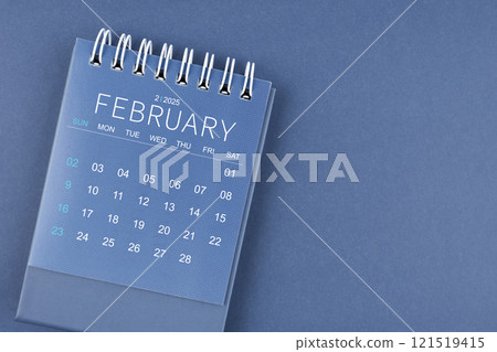 February 2025 calendar on blue color background. Desk calendar for planning. 121519415