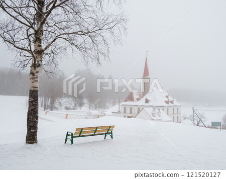 Gatchina Priory Palace in winter, bench near the palace Gatchina Priory Palace in winter, bench near the palace 121520127