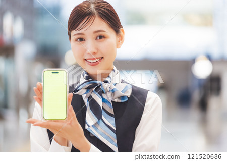 Image of a cabin attendant giving directions via smartphone Image of a cabin attendant giving directions via smartphone 121520686