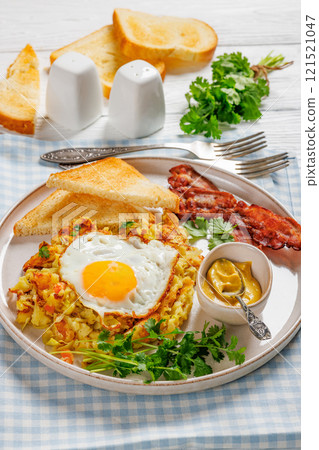 Bubble and Squeak with bacon, toasts, fried egg Bubble and Squeak with bacon, toasts, fried egg 121521047