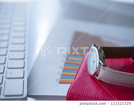 Graph, keyboard, notebook and watch on the table Graph, keyboard, notebook and watch on the table 121521329