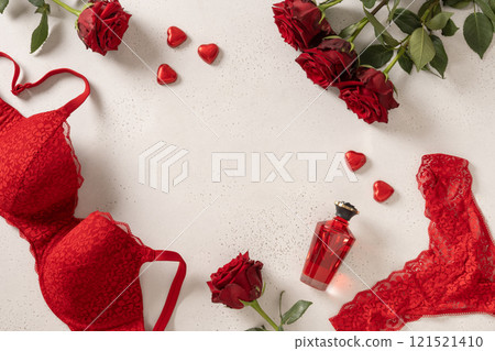 Valentine's day frame with red lace bustier underwear, gifts, candy sweets and red roses on white background. Love. View from above. Copy space. Romantic dating. Valentine's day frame with red lace bustier underwear, gifts, candy sweets and red roses on white background. Love. View from above. Copy space. Romantic dating. 121521410