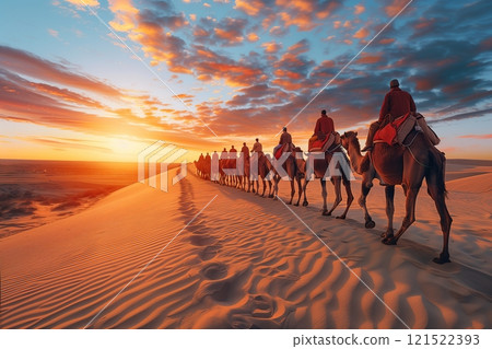 A caravan of camels traverses golden sand dunes at sunset, creating a mesmerizing view of nature's beauty. A caravan of camels traverses golden sand dunes at sunset, creating a mesmerizing view of nature's beauty. 121522393