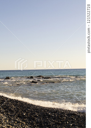 Splashes from the waves bumping against the rocky shore. Vertical photo Splashes from the waves bumping against the rocky shore. Vertical photo 121522728