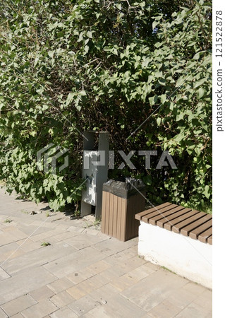 two trash cans, container for dog excrement in the park, close-up. place for walking dog in park. 121522878