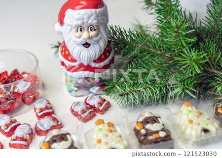 Christmas chocolates. Chocolate Christmas trees and Santa Claus. Christmas chocolates. Chocolate Christmas trees and Santa Claus. 121523030