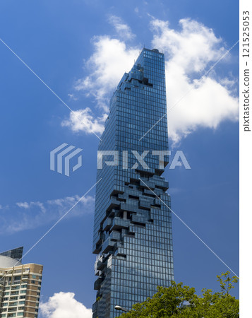 Mahanakhon Tower towering into the blue sky of Bangkok, Thailand 121525053