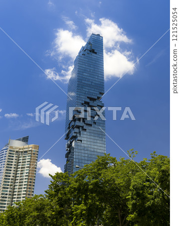 Mahanakhon Tower towering into the blue sky of Bangkok, Thailand Mahanakhon Tower towering into the blue sky of Bangkok, Thailand 121525054