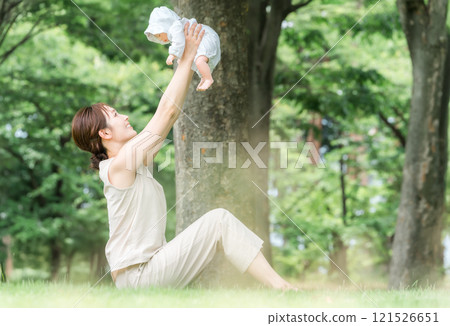 Baby yoga, mother doing parent-child yoga, young asian woman (yoga wear, park) 121526651