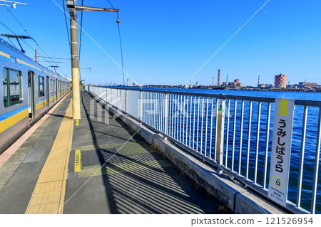 Yokohama City, Umi-Shibaura Station platform and Tsurumi Line E131 series train 121526954