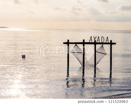 Sunset views from overwater pool villa in Maldives 121528963
