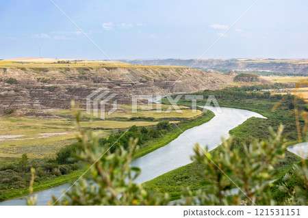 View to the river in the valley among badlands from the top of the hill. 121531151