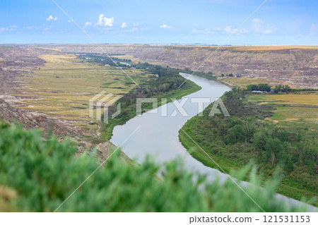 View to the river in the valley among badlands from the top of the hill. 121531153