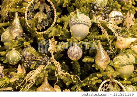 Christmas tree with acorns, bird, balls snowflakes and icicles. Christmas tree with acorns, bird, balls snowflakes and icicles. 121531159