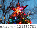 Red Star, Christmas Tree, and Colorful Lights at Dusk 121532781