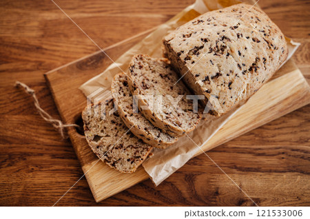 Homemade banana bread on wooden table 121533006