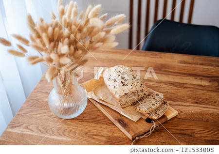 Homemade banana bread on wooden table 121533008