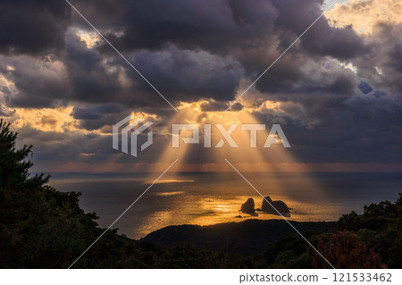 Angel's ladder pouring into the sea 121533462