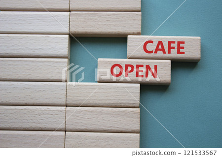 Cafe Open symbol. Concept word Cafe Open on wooden blocks. Beautiful grey green background. Business and Cafe Open concept. Copy space 121533567