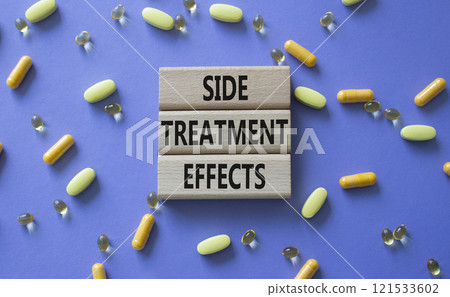 Side Treatment Effects symbol. Concept words Side Treatment Effects on wooden blocks. Beautiful purple background with pills. Healthcare and Side Treatment Effects concept. Copy space. 121533602