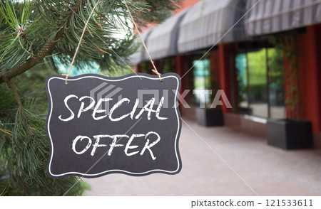 Special Offer symbol. Concept word Special Offer on black chalk background. Beautiful background with shop and tree. Business and Special Offer concept. Copy space Special Offer symbol. Concept word Special Offer on black chalk background. Beautiful background with shop and tree. Business and Special Offer concept. Copy space 121533611