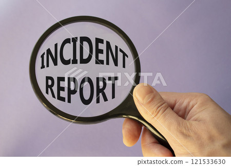 Incident Report symbol. Concept word Incident Report on magnifying glass. Businessman hand. Beautiful purple background. Business and Incident Report concept. Copy space Incident Report symbol. Concept word Incident Report on magnifying glass. Businessman hand. Beautiful purple background. Business and Incident Report concept. Copy space 121533630