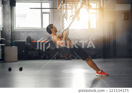 Dynamic Strength Training Enhanced with Resistance Bands in a Modern Gym Setting Today Dynamic Strength Training Enhanced with Resistance Bands in a Modern Gym Setting Today 121534175