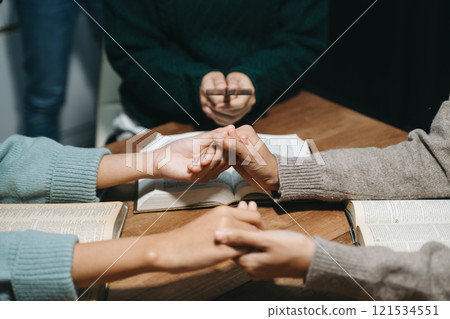 Christians are congregants join hands to pray and seek the blessings of God. 121534551