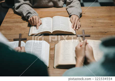 Christians are congregants join hands to pray and seek the blessings of God. 121534554
