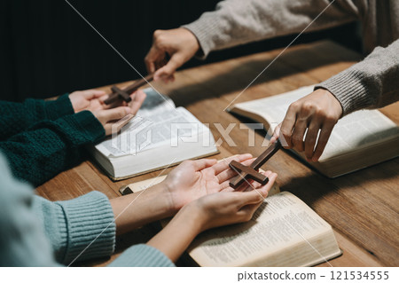 Christians are congregants join hands to pray and seek the blessings of God. 121534555
