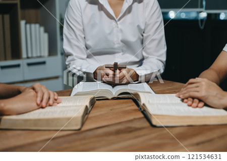 People reading and study bible in home and pray together.Studying the Word Of God People reading and study bible in home and pray together.Studying the Word Of God 121534631