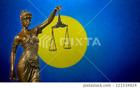 Lady Justice before a flag of Palau 121534924